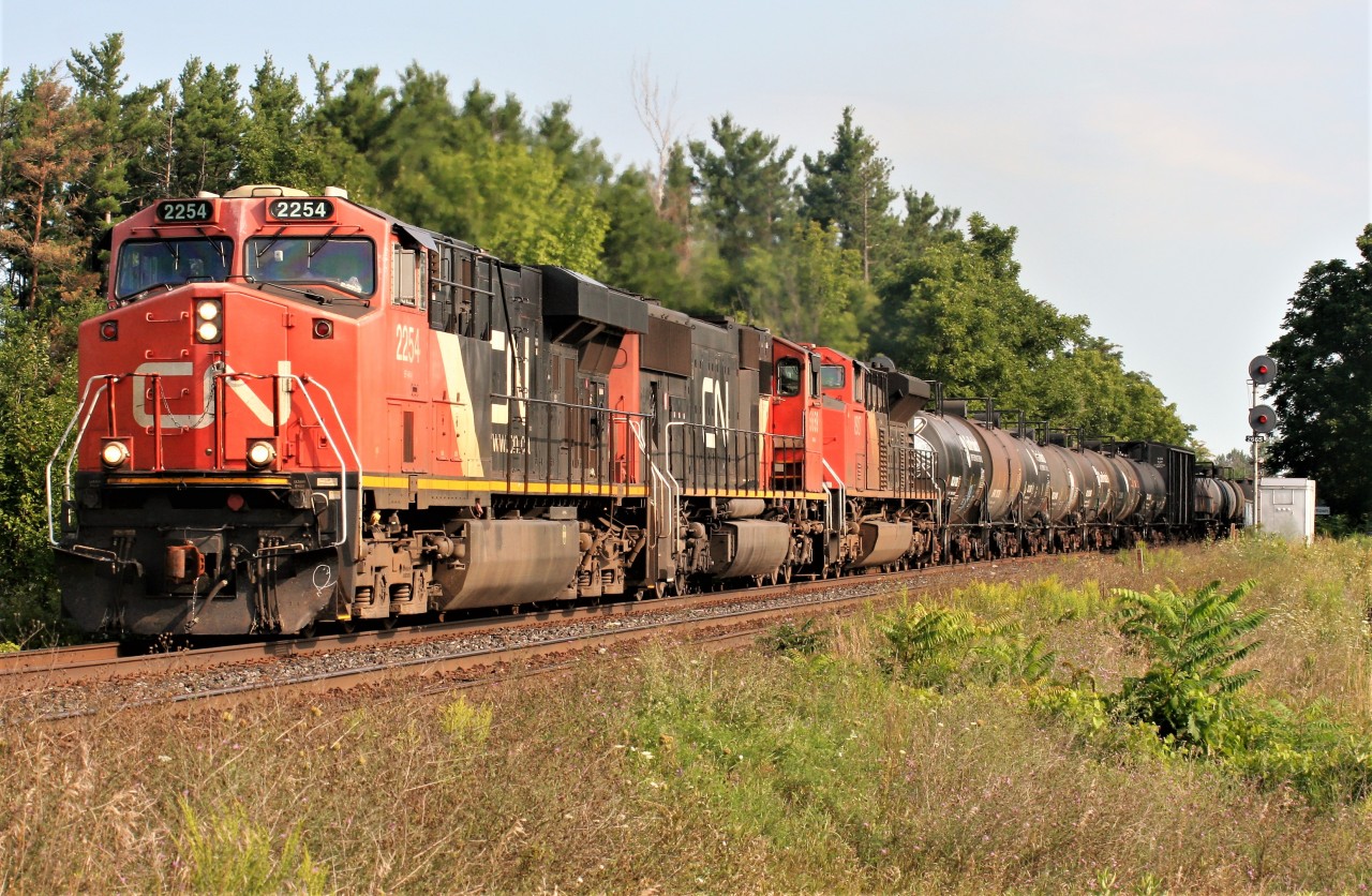 CN 421 is viewed at Stewarttown on the Halton Subdivision with 2254, 5659 and 8927 at 09:36.