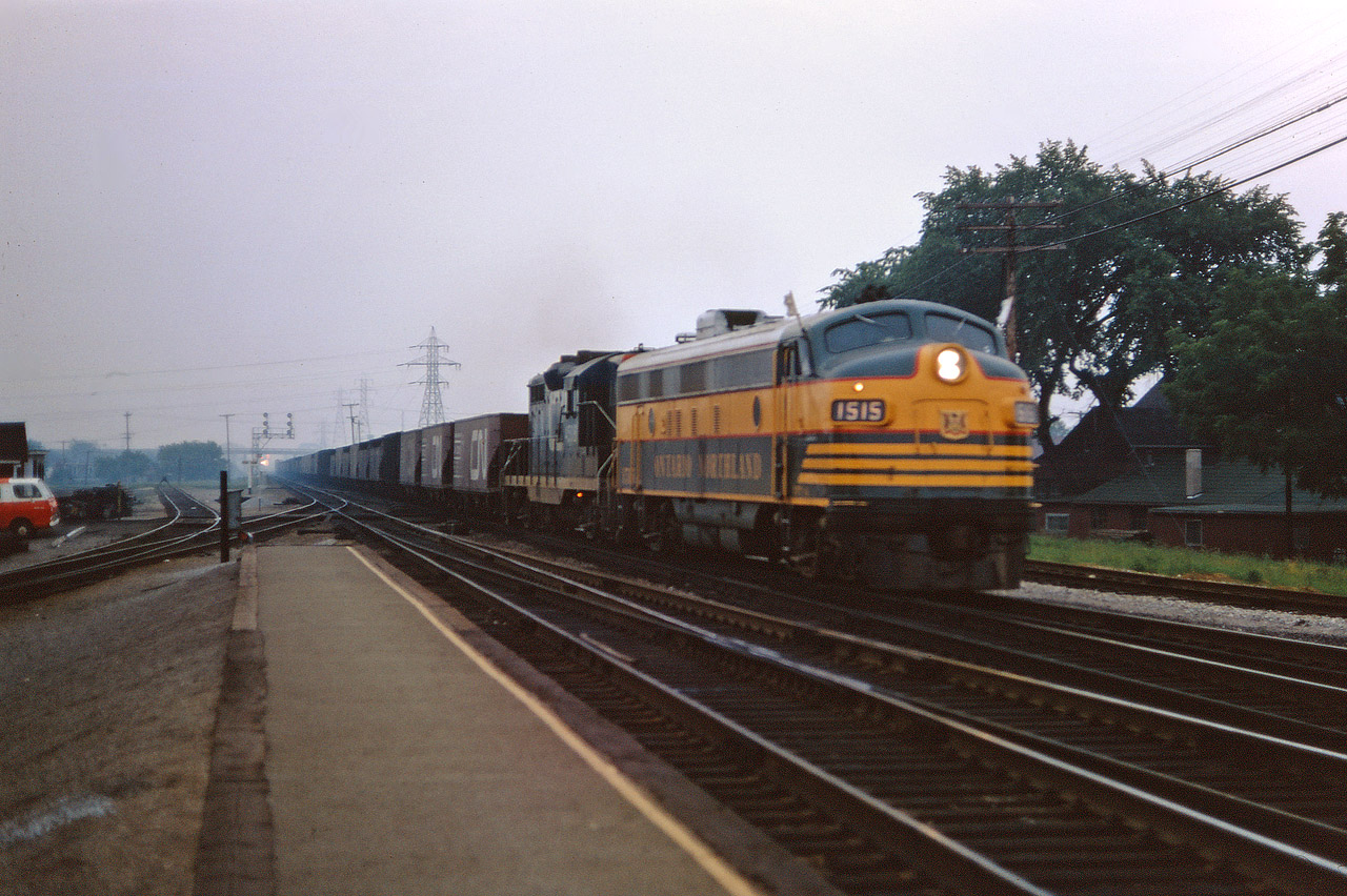 Ontario Northland FP7 1515 leads a CN GP9 (45xx) and and ore empties from the Oakville sub onto the Halton on a dull day in August 1967. An ON locomotive pooled with CN power was a bit unusual in the mid-1960s but did occur on a regular basis.