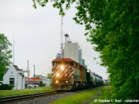 A pair of BC Rail (One in CN paint) Cowls on 331 passing the diminutive VIA station in Wyoming Ontario. Sarnia area isn't the best for photography but there are a few props in some towns between London and Sarnia.