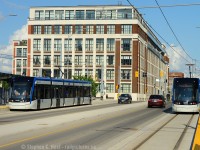 <b>Streetcars return to service on King St after 73 years</b> on the first official day of the ION LRT Network. Passing the iconic Kaufman building, streetcars last operated in passenger service on December 27 1946 when the Kitchener-Waterloo Railways system was shut down due to an ice storm. This event prematurely ended service on the line which was planned to end December 31 of 1946 and be replaced with Trolly Busses. It was a long time coming for ION and the transformation of Kitchener and Waterloo because of it is already staggering. If you told me 15 years ago weed would be legal and streetcars would roam the streets of K-W I'd tell you you've been smoking too much reefer. Ultimately, now that it's here my only thought now is as follows: Hamilton - what are you waiting for? And Congrats to Waterloo Region for making it possible. 