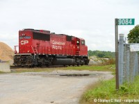 An odd scene as 6259 turns on the wye to bring a rail train east (was facing west). 9084 is the fire code for the CPR station/crew office at Guelph Junction that was built to replace the Guelph Junction station.Thank goodness those concrete barriers didn't go any further.