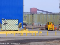 In response to Dan's photo of #90 in better days, these were Dark days for Stelco - the recession is in full swing, blast furnaces are (almost) shut down permanently and nothing was really moving at the plant, just chemicals for coke making. You can see US steel is keeping the workers busy painting buildings that ugly sky blue... god.. and on March 20 2011 I chanced on #90 switching these tanks.. from a distance - using a telephoto plus a crop D90 at 300mm equivalent. Best I have.  At least I managed all 3 active Hamilton units on the roster, but I was hoping to do better with #90 some day. Maybe it'll come back or they may opt to transfer a unit from Nanticoke some day if Hamilton picks up again. Big if.

