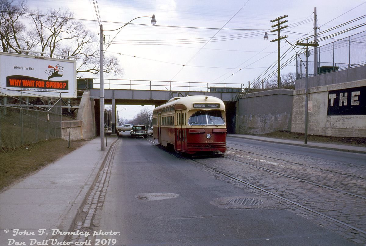 TTC PCC 4375 (an A6 car built new by CC&F in 1947/48) operates on a Saturday run of the Coxwell streetcar known as the "Kingston Road-Coxwell" route, heading northbound to Danforth Avenue on Coxwell Avenue after having just passed under the CN Kingston Sub underpass between Hanson and Gerrard.

Regular weekday Coxwell route service ran along Coxwell Avenue between loops at Danforth and Queen, but as per Transit Toronto's Coxwell streetcar route history, evening, weekend and holiday service at the south end was extended east from Coxwell along Queen-Kingston to Bingham Loop near Victoria Park. When the Bloor-Danforth subway was opened a few months later in February 1966 the Coxwell streetcar service was discontinued, although tracks remained on a few portions of Coxwell for deadheading cars (and still do between Gerrard and Queen).

John F. Bromley photo, Dan Dell'Unto collection slide.