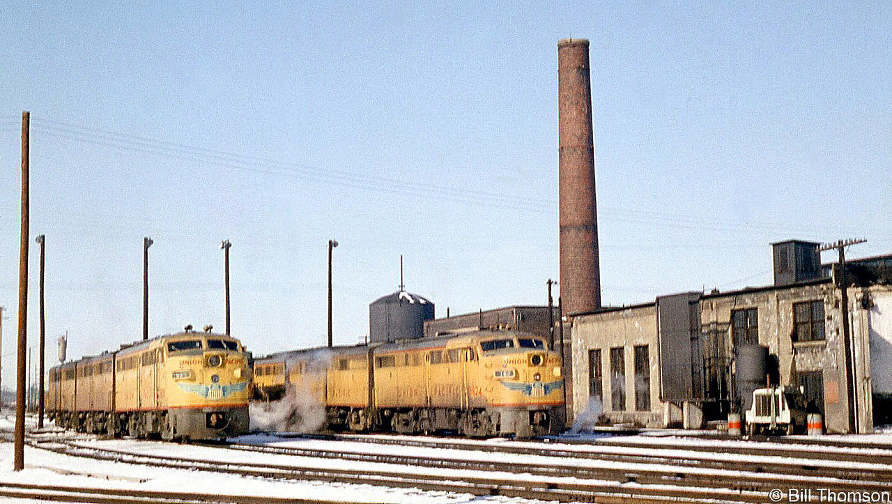 Two sets of Union Pacific 1600-series Alco FA1/FB1 units are shown parked at CP's Lambton Yard engine terminal in March of 1964. Rather than reactivate some of their stored steam engines, in the early 60's power-short CP opted to lease surplus power from other railroads instead. Rumour has it UP pulled their FA/FB units from the deadlines to lease to CP in 1963/1964, and they mostly ran in solid UP sets. The units were built in the late 40's and after years of use on the UP were at the end of their lifespans. Upon return to the UP, they were used as trade-in credit to EMD the next year, and ultimately all scrapped.