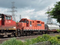 CCGX 4024 could be getting a reprieve from the fate of most of its siblings in CP's GP9 fleet.<br><br>
It was seen westbound near CN Aldershot East behind the active locos of a CN mixed freight train on 25 June 2019 at 11:36 EDT.  Powering the train were GE's CN 2233, CN 2511, and CN 2598.