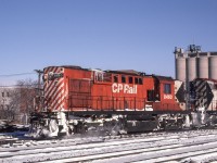 Peter Jobe photographed CP 8463 in Toronto on December 14, 1980. While some see only a roster shot, the man on the far left throwing the switch and the silos in the background add interest.