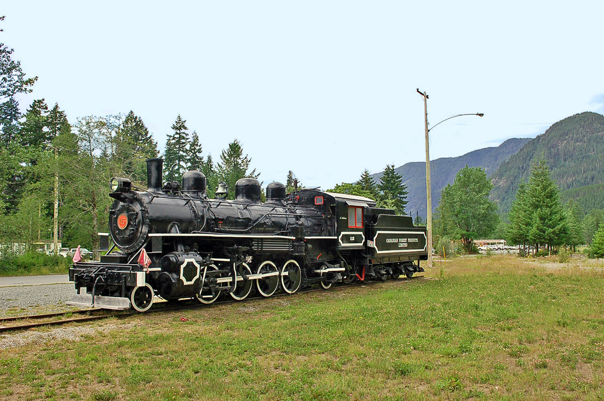 Canadian Forest Products 2-8-2 type steam locomotive #113 on display at Woss, BC. 135 tons, built by Alco in 1920. This photo is from a trip my wife & took out west on VIA Rail’s ‘Skeena’ & ‘Canadian’ – taking the ‘Canadian’ from Toronto to Edmonton, stopping over in Alberta to explore the Rockies and various preserved railway equipment by rental car before taking VIA Rail’s ‘Skeena’ from Jasper through the Rockies to Prince Rupert then boarding the ferry to Port Hardy to visit Vancouver Island & various preserved equipment there. For more pics from this trip see our website at: 
 http://northamericabyrail.info/a-trip-on-via-rails-skeena-jasper-ab-prince-rupert-bc/  
Cheers, Pete
