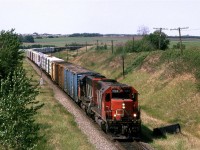 Fred Clark and I moved at little more south to the Wainwright Sub. I never though much of the Wainwright Sub. It is straight, and flat (OK, the notable exceptions are the mileage right around Edmonton, and the Fabyan Bridge). Now, Fred would beg to differ. He seems to find it interesting.
So, we are at a spot easily accessible by bicycle, even when we have a car. I guess this was too novel for us ;-)
This is a typical daily wood product train that came out of Prince George. There were 2 on the tracks west of Edmonton (358 and 360). 358 traversed the Vegreville sub as it progressed east, while 360 used the Wainwright Sub.
..... and we have a conventional cab leading. 