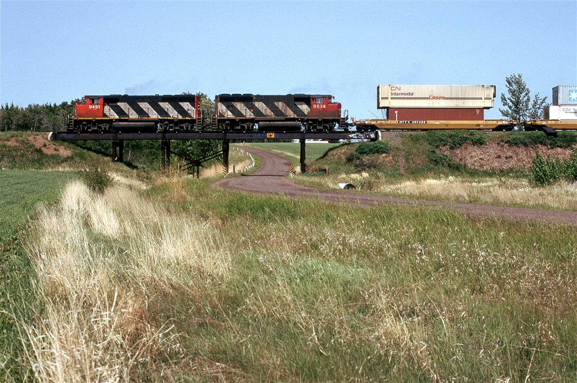 Continuing my day out with Fred Clark, we hung out at this bridge for this double stack intermodal train.We did not hear what its designation was, though.