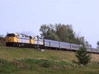 VIA's "Canadian" makes its appearance at Carvel and mid-morning. We lucked out here because had the train been put on the north track, about a foot or two of the bottom of the train would have been blocked due to our below-the-track position,