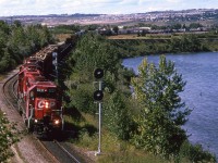 A more conventional view of east Brickburn siding. Due to severe erosion caused by a flooding Bow River, the mainline was shifted to the left, where the siding resided. The siding was removed, which I assume was not welcomed by the dispatchers.