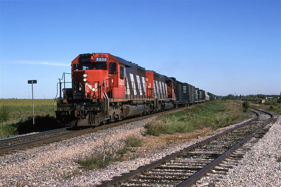 359 is the empty wood products train that traverses the Vegreville sub. It is headed to Prince George.
Oliver seems to be a short siding primarily used by MOW crews.