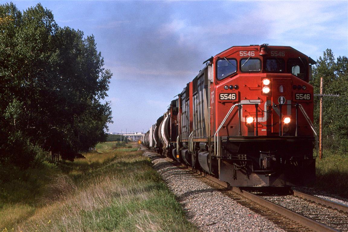 Up until a few moments ago, I thought that this was a potash empty returning to the mines in Saskatchewan, and that I typed the wrong train designation. But upon further review, this appears to be a Phosphate train going to Sherritt International, a fertilizer manufacturer in Fort Saskatchewan. Trackside Guide 1997 does not show this train.
If anyone has different, or additional information, I would be pleased to hear from you.