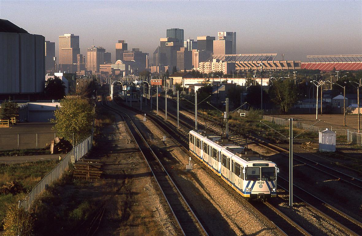 An LRT train accelerates out of Coliseum Station. That is where the Oilers used to play until the NHL extorted Edmonton into building another arena downtown. Commonwealth Stadium, another sports boondogle may also be seen.
One more editorial. Edmonton put in this LRT line because Calgary had one. Calgary's went where people lived. Edmonton's, not so much. It took them forever to get to the University and beyond. I think that it is now a reasonable system.