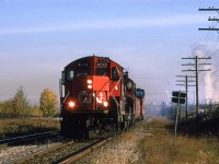 520 was a fairly predictable train out of Walker Yard. It would head out The Wainwright and then down the Camrose Sub in very favorable light. Today, they do not have much work. I don't think that they even went to Carmose, or even left Edmonton.
Steam rises in the still air at Celenese in the background. It not even October and the leaves have lost their chlorophyll.