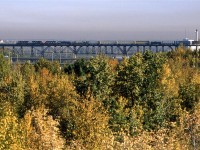 After dropping a substantail portion of their train in Clover Bar, 219 continues to Walker Yard where the train terminates.
This is a rather different view of the high bridge over the North Saskatchewan River.
The Edmonton Power plant seen at right is long gone.