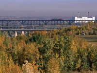 In all likelihood, this is a Clover Bar Transfer returning to Walker Yard
This is a rather different view of the high bridge over the North Saskatchewan River.
The Edmonton Power plant seen at right is long gone.
The yellow posts in the foreground support ski lift lines.
identified location is approximate.