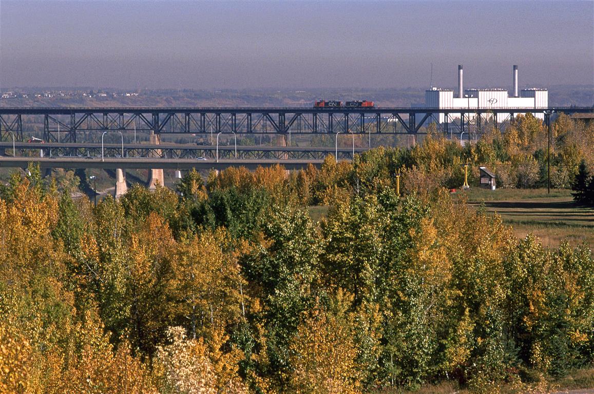In all likelihood, this is a Clover Bar Transfer returning to Walker Yard
This is a rather different view of the high bridge over the North Saskatchewan River.
The Edmonton Power plant seen at right is long gone.
The yellow posts in the foreground support ski lift lines.
identified location is approximate.
