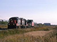 520 returning north on the Camrose Sub. It wasn't gone very long, therefore, I do not believe that it went very far this day. It seemed to have simply replaced one gondola car for another.