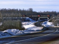 419 is the nearly daily manifest train north out of Edmonton's Walker Yard to McLannan on the Westlock Sub. This is a former NAR line. Just north of Edmonton, the line crosses the Sturgeon River Valley, a fairly wide, but not too deep hurdle for the RR. The actual crossing is on a reasonably impressive wood trestle. The trains is on the west side of the valley, working up the grade - the top is at Carbondale, proper.