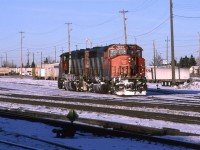 I believe that this is the power off of 122, heading for the shops via the bypass track on the south side of the yard. Certainly some of the locomotive got, and remain very cold from the trip into town from the west.
I was able to get these winter shots because my wife bought me a mountain bike at Xmas.