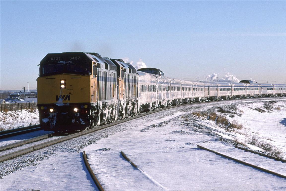 the "Canadian's" trip across the prairies east of Edmonton must have been much more brutal than experienced here. Alberta is experiencing the "Idaho High", a period when a high pressure zone sits on Idaho, giving us "warm" dry conditions.
The train is partially on some temporary tracks so that a bridge can be constructed on the original alignment