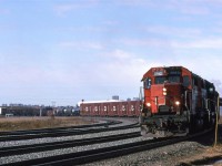424 swings into Clover Bar Yard, where if I recall correctly, they will do some switching. Downtown may be seen over the wood chip (?) cars and apartments that line the south side of the river valley may be seen at left. Celenese is making all the steam at right.