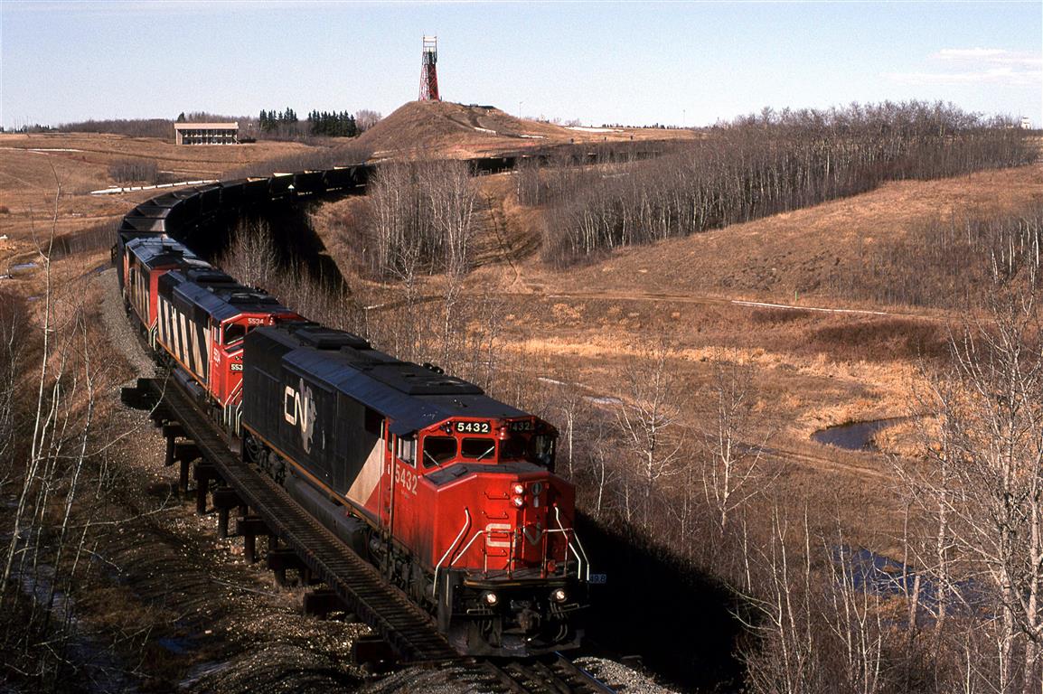 Vancouver to Strachan sulphur empties glides down Camrose Creek on the south side of Camrose. Strachan is west of Red Deer in the heart of a huge sour gas field.