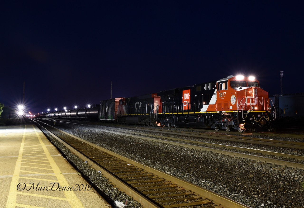 With the derailment in the St. Clair River Tunnel traffic in and out of Sarnia has slowed to a trickle. Here a brand new CN 3877 leads train 383 into "C" Yard before shoving back into "A" Yard.