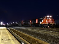 With the derailment in the St. Clair River Tunnel traffic in and out of Sarnia has slowed to a trickle. Here a brand new CN 3877 leads train 383 into "C" Yard before shoving back into "A" Yard.