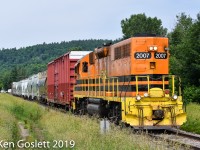 Quebec Gatineau's Thurso-Ste Therese turn is shown eastbound at Calumet on a hot July morning.