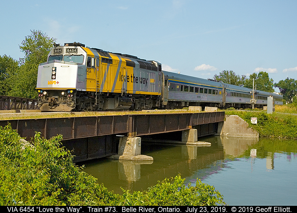 VIA 6454, with it's new "Love the way" slogan on it's flanks, leads train #73 through, and over, Belle River, Ontario on July 23, 2019.