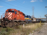 After clearing VACIS CP 5910 and ICE 6440 lead this empty tank train under Oullette Ave. minutes before entering the tunnel for the US.