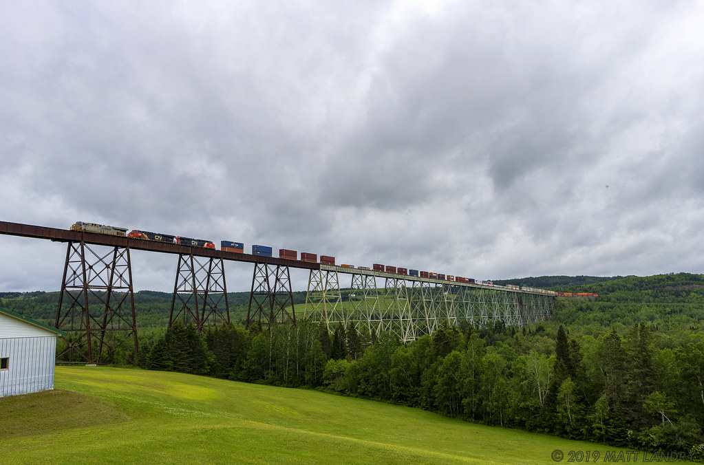 Leaser unit CREX 1518 is in charge of stack train Q121, as they rumble across the 3,920 foot Salmon River Trestle.