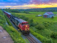  Nearing the day's last light, CN cowl 2431 leads train 406, as they approach Sussex, New Brunswick.