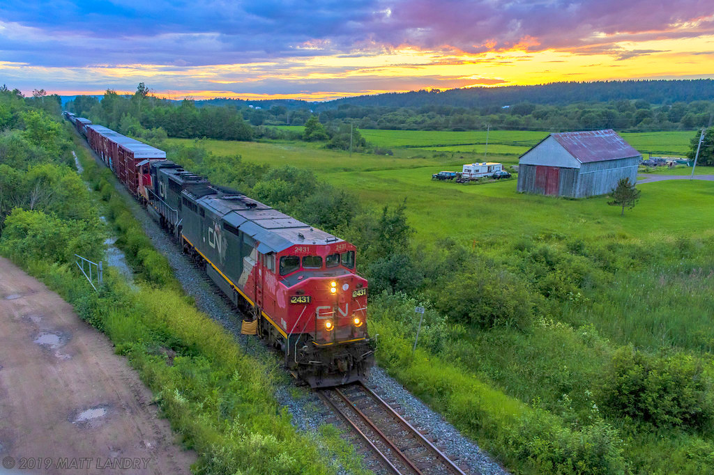 Nearing the day's last light, CN cowl 2431 leads train 406, as they approach Sussex, New Brunswick.