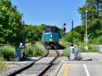 VIA 84 had a bit of a detour on the morning of July 14 at Georgetown. It appears that the night before, a eastbound CN manifest broke apart just east of the station on the south track and the freight cars were still sitting there the next morning. So with the freight cars clogging up the platform track in which all VIAs almost always arrive and depart from, todays VIA 84 ended up arriving and departing from the thru GO train track which is used by the weekday GO trains which continue on past Georgetown and towards Kitchener on the Guelph Sub. So here we see VIA 84 pulling into the station on the thru GO Transit Track and F40-PH 6421 was the leader! 