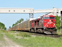 CP 9831 and an older GE sister lead a westbound through Zorra just after 17:00 on a spring evening. 