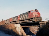 Each afternoon hanging around Bayview we usually hung in until the daily "Pulp" train rolled thru. It often had interesting power. This day's version had CN 9550, 2573 and 5517. GMD-MLW-GMD.  Not bad.  The train is seen heading toward Niagara from MacYard;  mile 37 Oakville Sub at the old Valley Inn Rd bridge. The road is no longer, reduced to a hiking trail. The power is no longer (9550 ret'd 2000) as well as the train, due to the fact the Pulp and Paper company at Thorold is no longer in business.
Times change..............