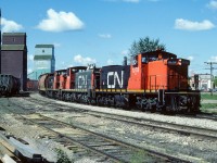 A photo to go with my last post. Almost the same spot, but, 34 years earlier. In my 2019 photo, I am closer to where the hoppers are and a little further away from the track. No SD40's allowed back then, the big power in 85 were the GP38's. Speaking of 85 and Eric Mays recent post and mention of 80lb rail. The mailine here is 85lb rail and the elevator track in the foreground is 60lb spaghetti rail. Hefty stuff :-) In this photo the 1078, 1069 and 1075 are passing through Redwater at 11:00 and headed for the air base at Cold Lake.