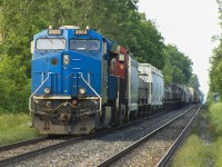 As most of us living in Southwestern Ontario experienced, we saw the increase of rerouted trains due to the Sarnia Tunnel derailment that occurred at the end of June. Here, in Chatham most rerouted trains would sit for hours on end on the outskirts of town as the Chatham Subdivision was only single tracked from 'Chatham East' all the way to Windsor. Add this with the eight VIA trains that stop in Chatham, it was quite congested between both  the rerouted traffic going both east and west. 
<br>
<br>
Here, leased unit 2033 leads CN 367 west to Windsor. Well, it will as they sit and wait for eastbound reroute CN 324 and the two VIA's on this wonderful Sunday evening in early July. To make this night even more better, after taking this photo I had a half hour conversation with the conductor at the Hwy 40 crossing. 