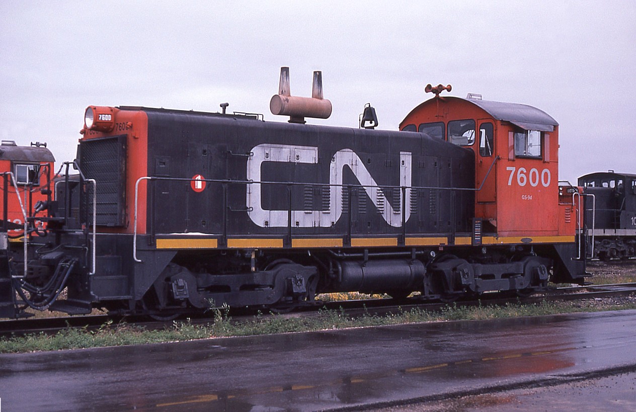 Visiting the sprawling Symington Yards in Winnipeg many years ago on a most miserable rainy day (so what else is new?) I came away with the realization it was not an easy place to shoot. Sure, lots of GMD-1s around, and a handful of cab units, but I was pleased to see a couple of SW900 switchers.  I did not recall seeing a 7600 series switcher before. Not many around either. Six of this series of nine (7600-7608) were renumbered to the 400s in 1979.