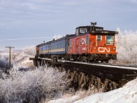 One more set of photos from Redwater, this time located at the Redwater river trestle. Mother nature must have known Christmas was coming this season. There was frost on the trees right into the New Year. This short lived passenger train to Fort McMurray consisted of baggage car 7857 and coach 5099 today. It passed through town just after lunch every Monday, until discontinued. (The 5587 was renumbered to 4787).