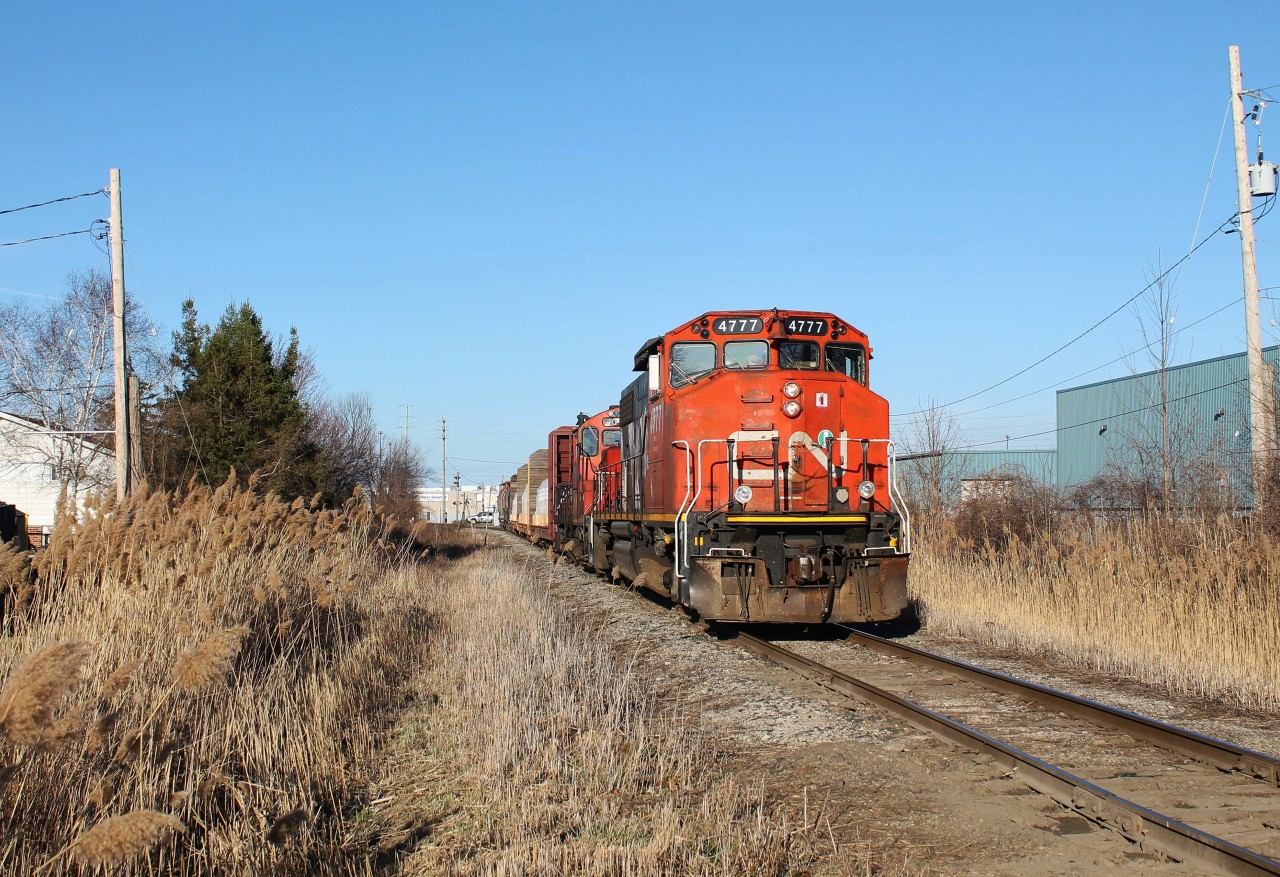 The daily CN local heads back west after working a transload facility on the Chrysler Spur.