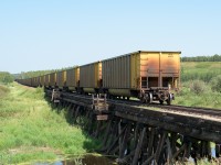 One more set of photos from Redwater, this time located at the Redwater river trestle. The train is the same as in my previous 2018 SD40 photo. Not much has changed in 32 years. Overhead powerlines are gone, trees have grown or been cut, barrels are removed from the trestle. Oh Yeah, and no caboose :-).