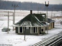 CN's Watford Station is pictured in this snowy January 1983 scene, located at Mile 33.2 of CN's Strathroy Subdivision. This view is looking west off the Main Street bridge to the east.
<br><br>
By 1987 a VIA "kiosk station" had been erected next to the CN station. Both are gone today, although the building pictured next to the station remains, in use by CN maintenance of way crews.