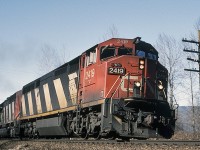 CN 2419 with the 5511 trailing are headed east at Milepost 61.1 on CN's Yale Sub at Rosedale. The 2419 is a GE Dash 8-40CM built in 1990. I read somewhere that only half of them had nose bells. The 5511 is an EMD SD60F built in 1989 and retired in 2017. I often have to question the dates I recorded on these photos. This one was taken on February 26th 1995. The weather in this area back then was very mild and raining most of the time. More like the North Pole now. 