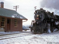 Canadian National Mikado 3422 (an S1f class unit originally built by Alco in 1913 for the GTR) handles the Sarnia-Stratford wayfreight as it steams past CN's Camlachie station on a snowy day in 1959. <br><br> Camlachie was located at Mile 56.69 of CN's Forest Subdivision, which originally opened in the 1850's as part of the Grand Trunk's Sarnia-Toronto mainline. As the CN Forest Sub, the line ran between St. Mary's Junction to Sarnia Junction and served as a branchline until it was abandoned in portions during the 1980's. <br><br> A CN RSC13 in front of Forest Station: <a href="http://www.railpictures.ca/?attachment_id=18320"><b>http://www.railpictures.ca/?attachment_id=18320</b></a>.