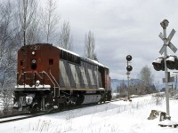 CN 5420, a GMD SD50F built in '85 looks lonely and cold as it slowly moves westward at Rosedale.