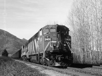 CN 2400, a GE Dash 8-40CM, with the 2521 trailing are in the siding at Arnold to let a westbound pass before continuing eastward and eventually up and through the Fraser & Thompson canyons.  